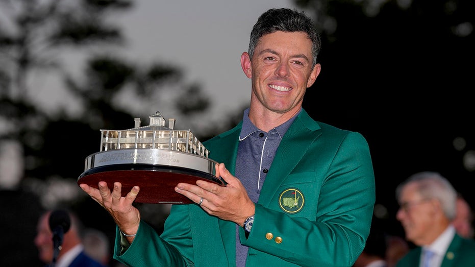 Rory McIlroy holds the trophy