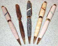 pink corian blue accent - black walnut - black corian - figured aspen - pink corian green accent.jpg