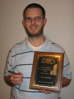 ben with plaque.JPG
