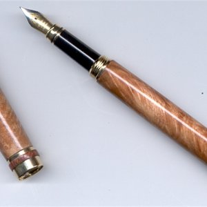 Closed end Maple Burl with custom ring band.