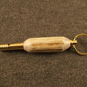 Deer antler whistle.