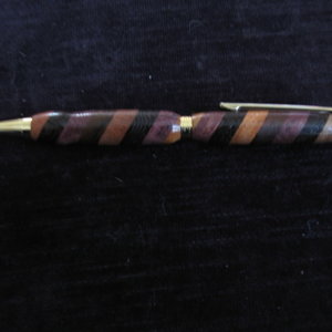 Segmented pen of Purple Heart, Nogal, Jotoba, Wenge, Santos Mahogany