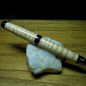 007: curly maple cigar black titanium