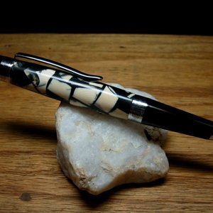 012: Mammoth ivory cast in black alumilite resin