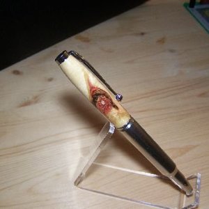 Flame Box Elder Burl on 30.06 Bullet, silver bullet tip