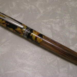 First closed end! Ligero in Calico resin and Walnut.