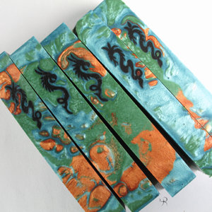 Jeff Powell's dragons on a green field.