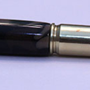 5.56 Nato cartridge pen with a camo blank.