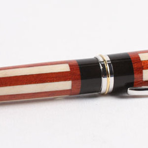 Jr. Gent II with Holly, Bloodwood, Ebony