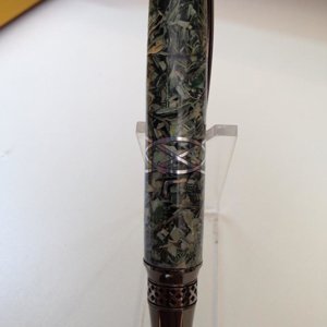 Shredded currency with an Aluminum Celtic Knot