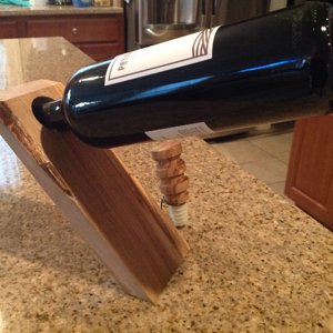 Floating wine bottle holder