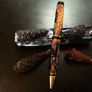small pine cones in blue galaxy alumilite resin