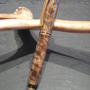 Figured Asian Satin wood with a gold Baron kit.