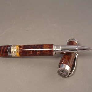 Closed end Statesman rollerball in Curly Koa wood