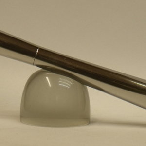 A shiny round square pen
