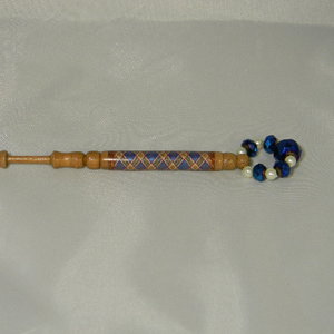 Lace bobbin with thread decorations