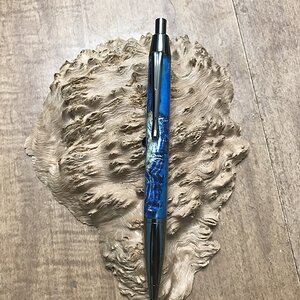 Blue Dyed Black Ash Burl with Blue Resin on a Devin Gun Metal Click Pen
