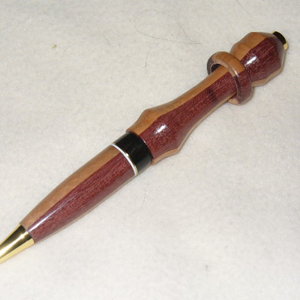 XXX-Captive ring in Purpleheart/Pernambuco-XXX
