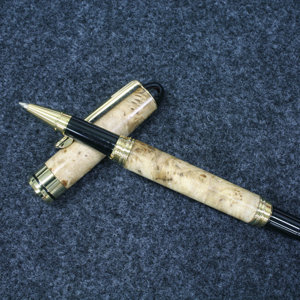 A gold European screw cap in Big Leaf Maple