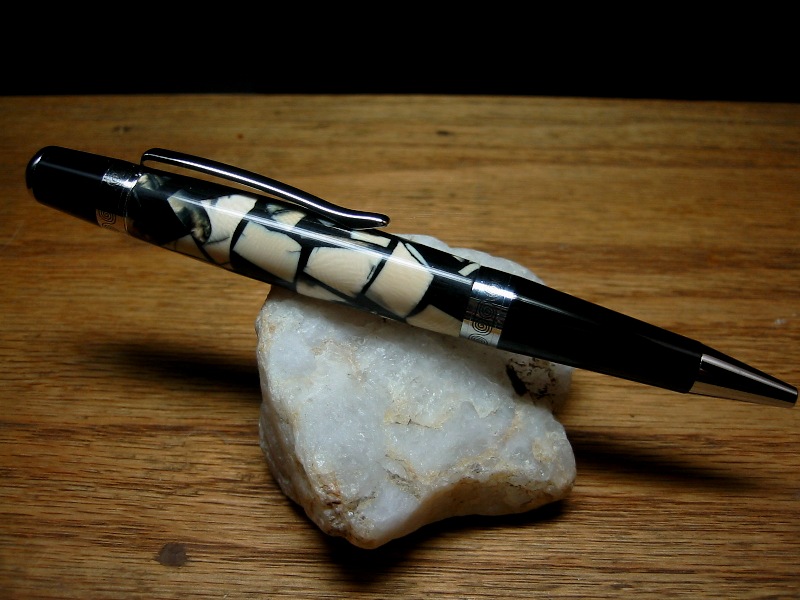 012: Mammoth ivory cast in black alumilite resin