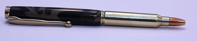 5.56 Nato cartridge pen with a camo blank.