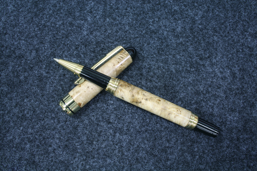 A gold European screw cap in Big Leaf Maple