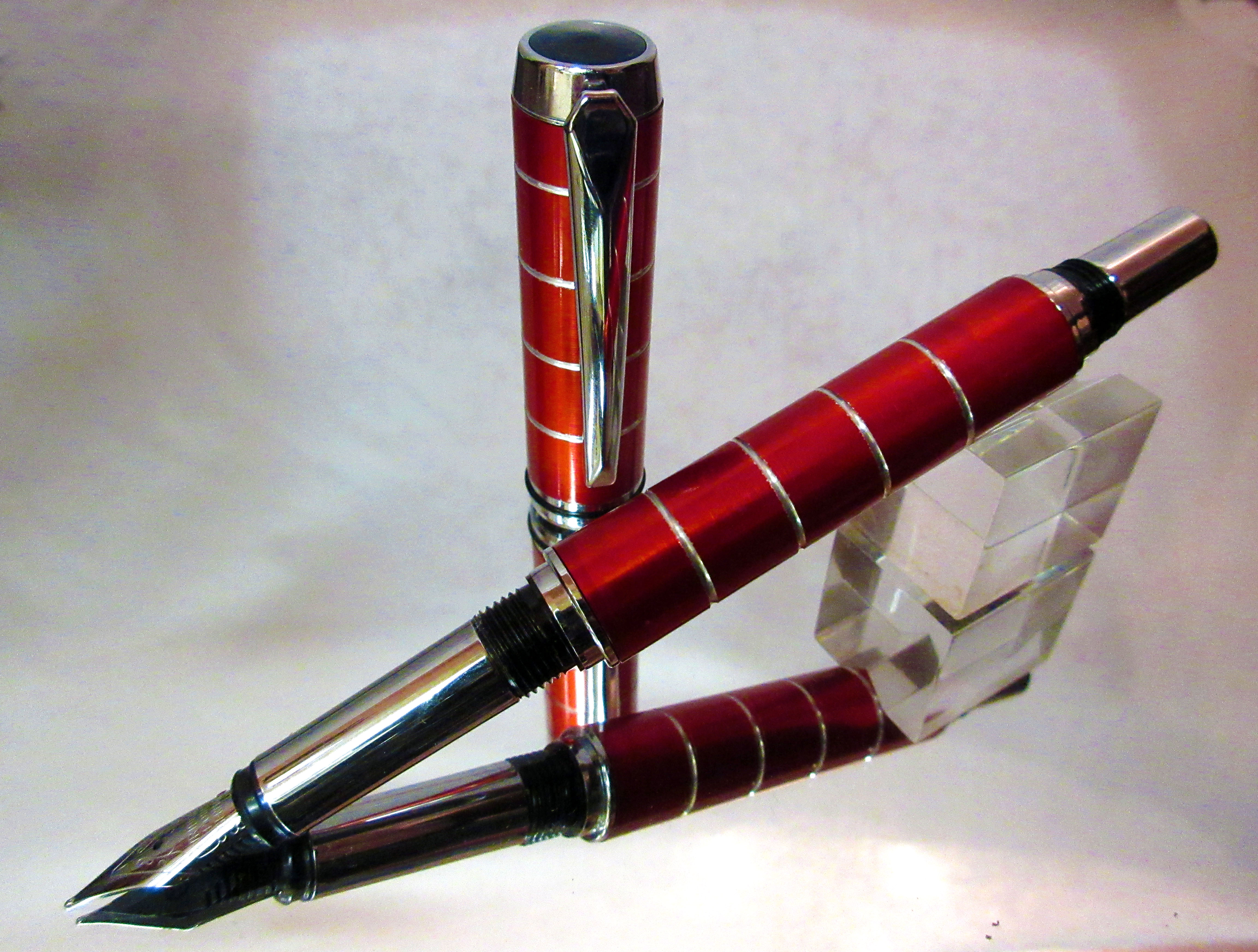 A Red fountain pen crafted from aluminium