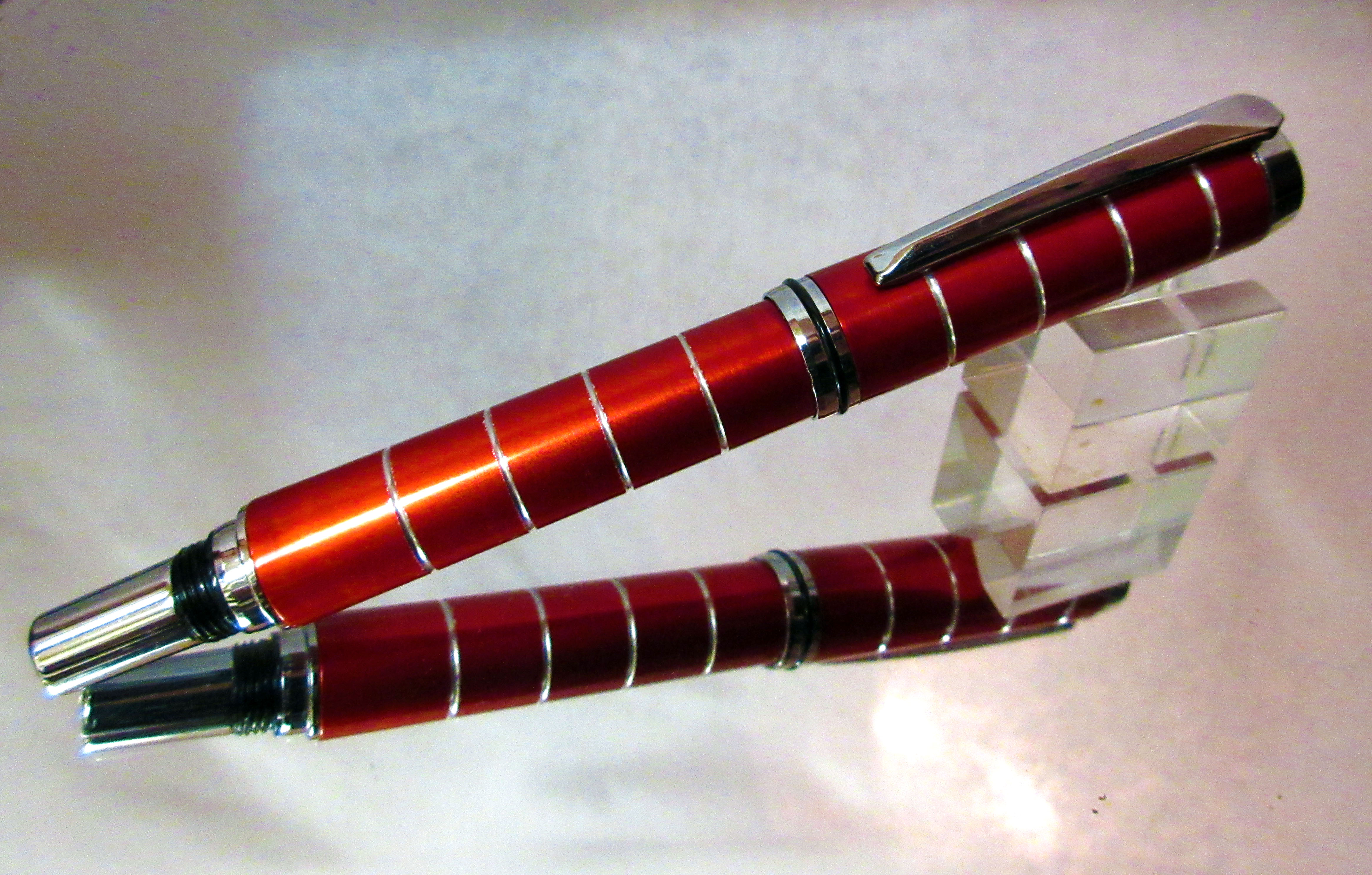 A Red fountain pen crafted from aluminium