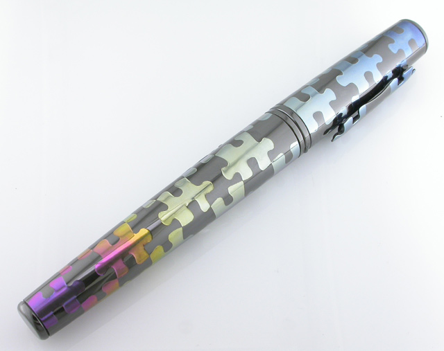 Anodized zirconium puzzle pen