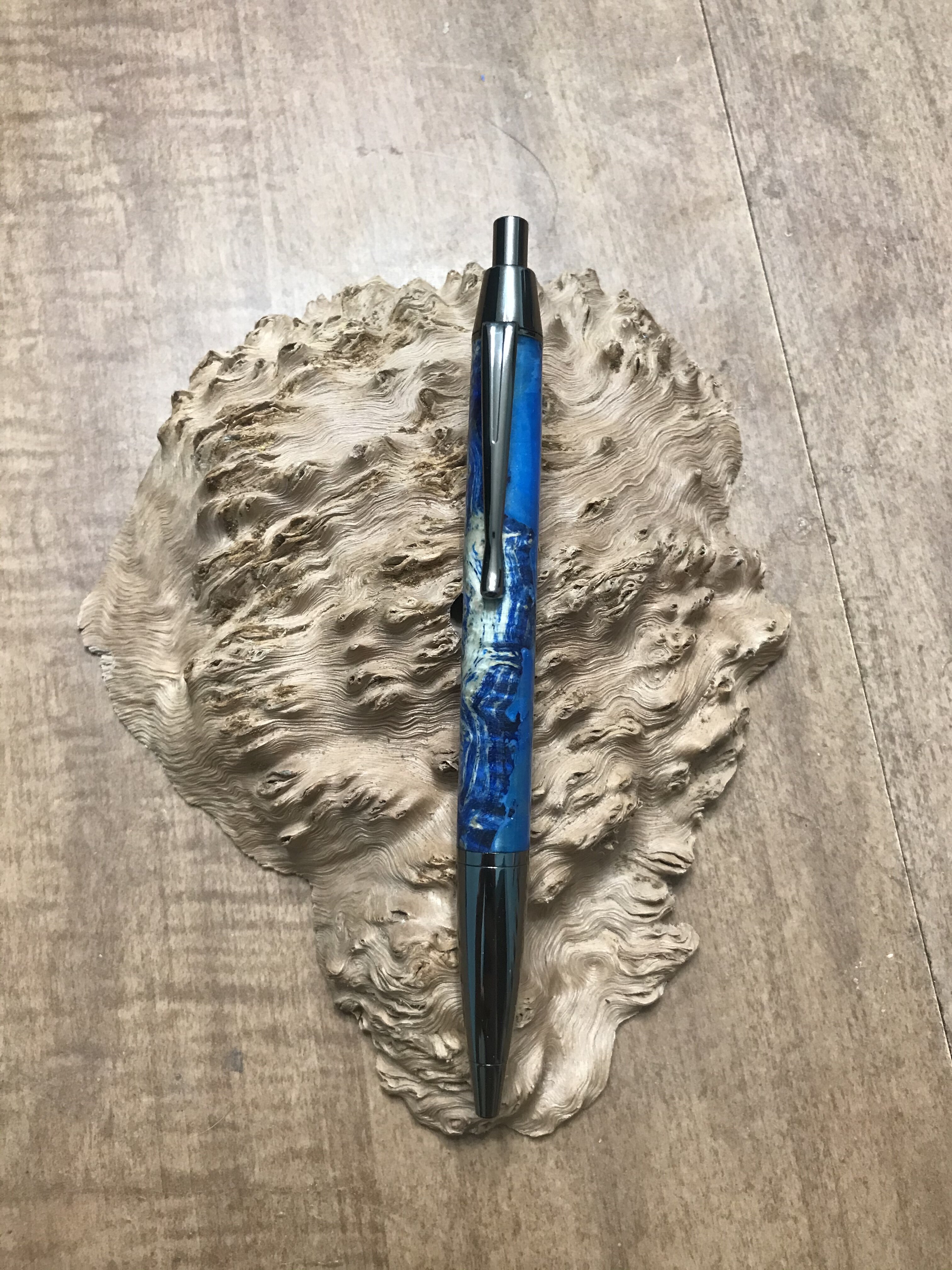 Blue Dyed Black Ash Burl with Blue Resin on a Devin Gun Metal Click Pen