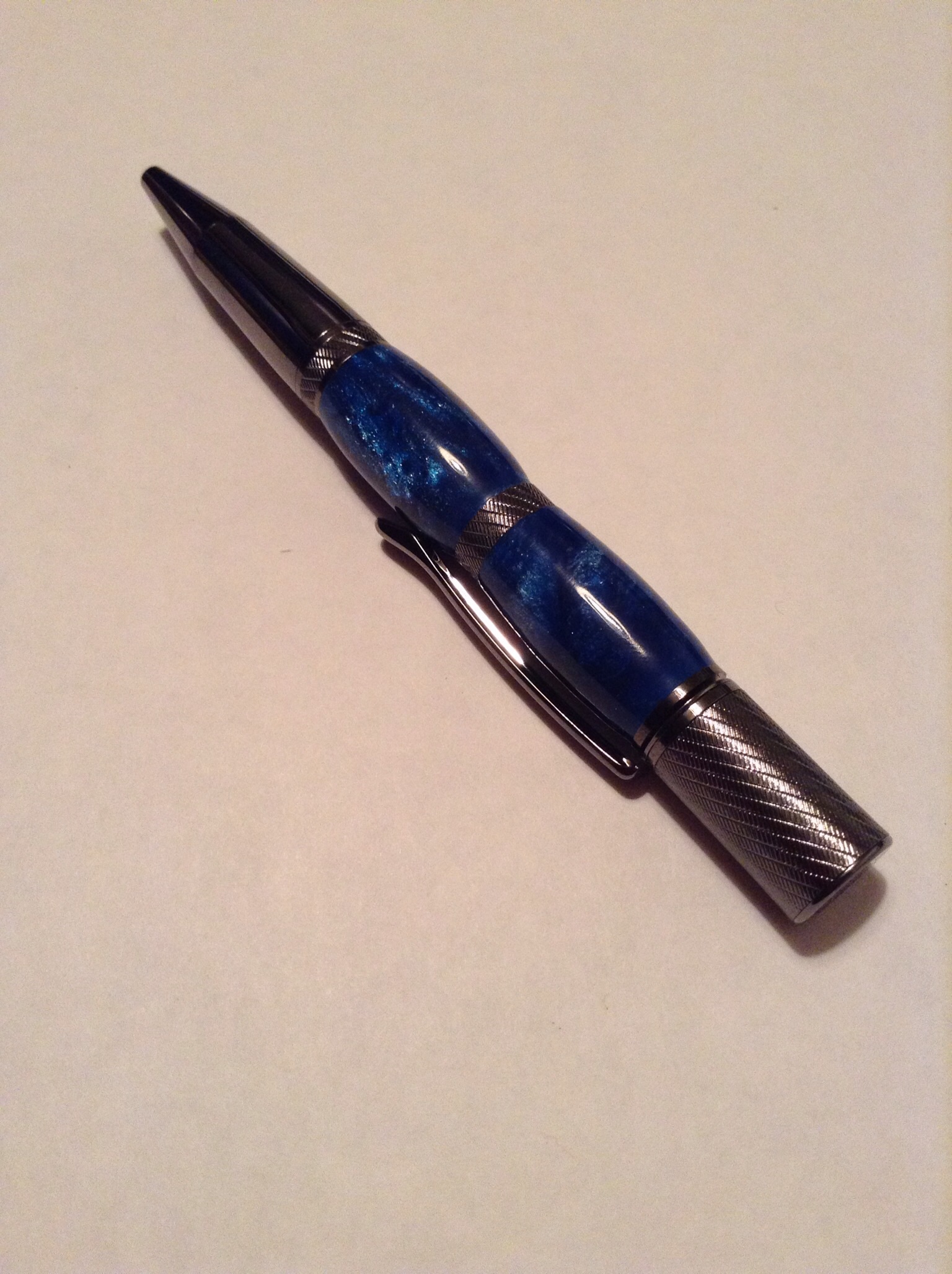 Blue sparkle pr on a gunmetal Pluma