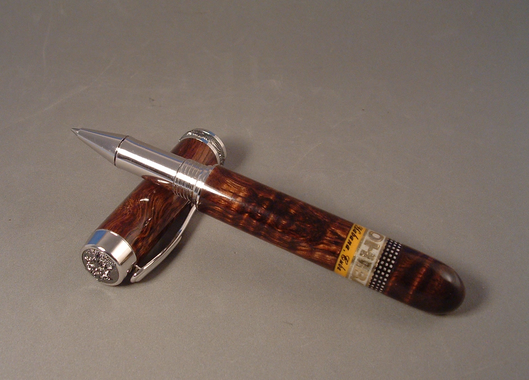 Closed end Statesman rollerball in Curly Koa wood