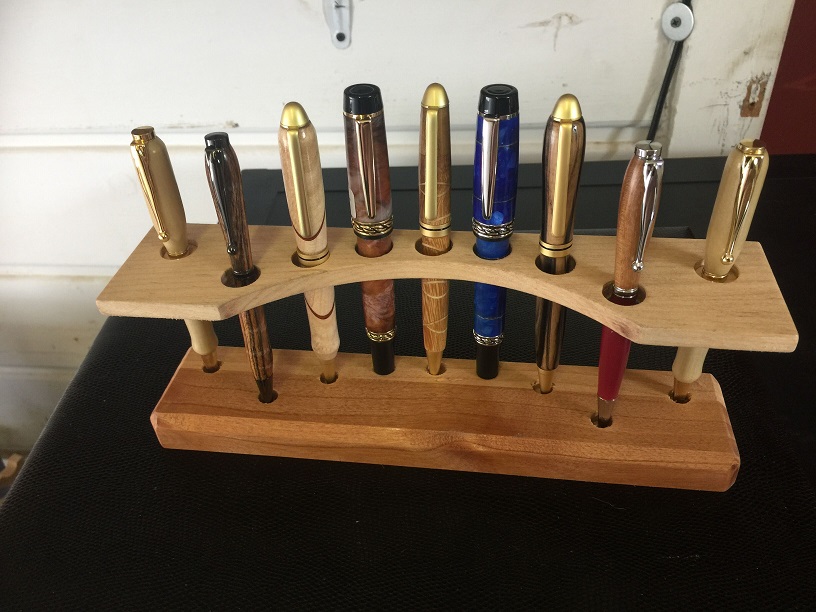 Floating shelf pen stand