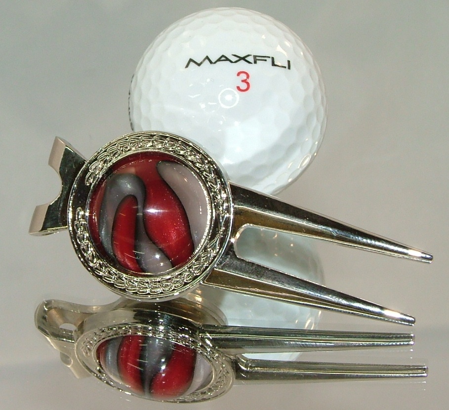 Golfball_divot_repair_tool.jpg