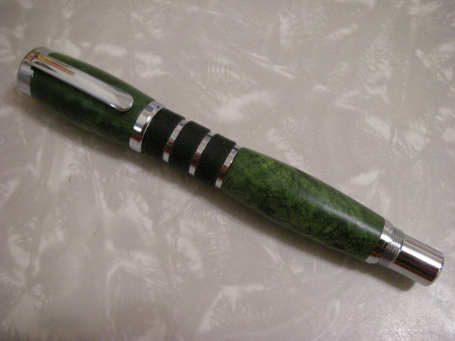 Guardian in Green Buckeye Burl with cap on