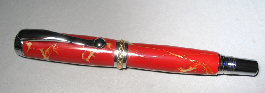 Triton FP in Red with Gold matrix tru-stone