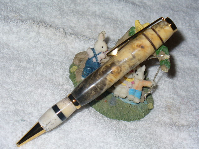 XXX-Box Elder burl; bottom is deer antler with ebony band